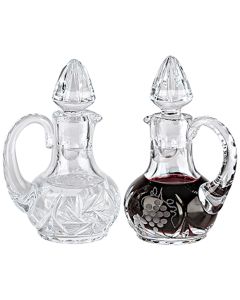 Crystal Cruets. 4-1/2"H., 2 oz. cap. Grape and leaf design on wine, pinwheel design on water. Pair